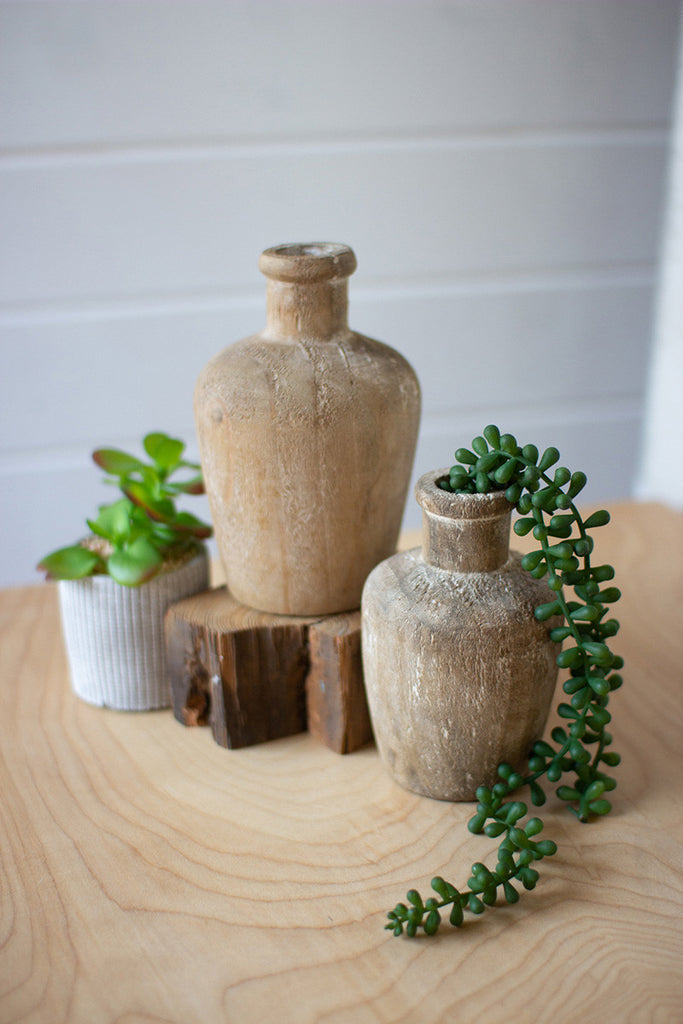 set of two carved shoulder wooden bottles