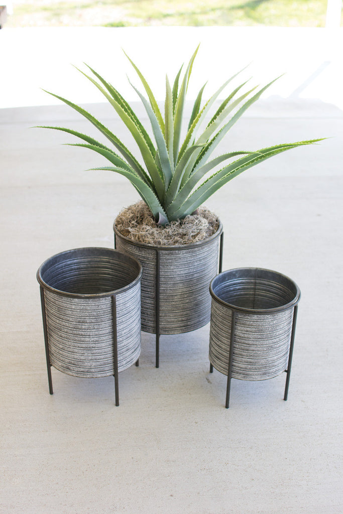 set of 3 galvanized metal planters with iron bases