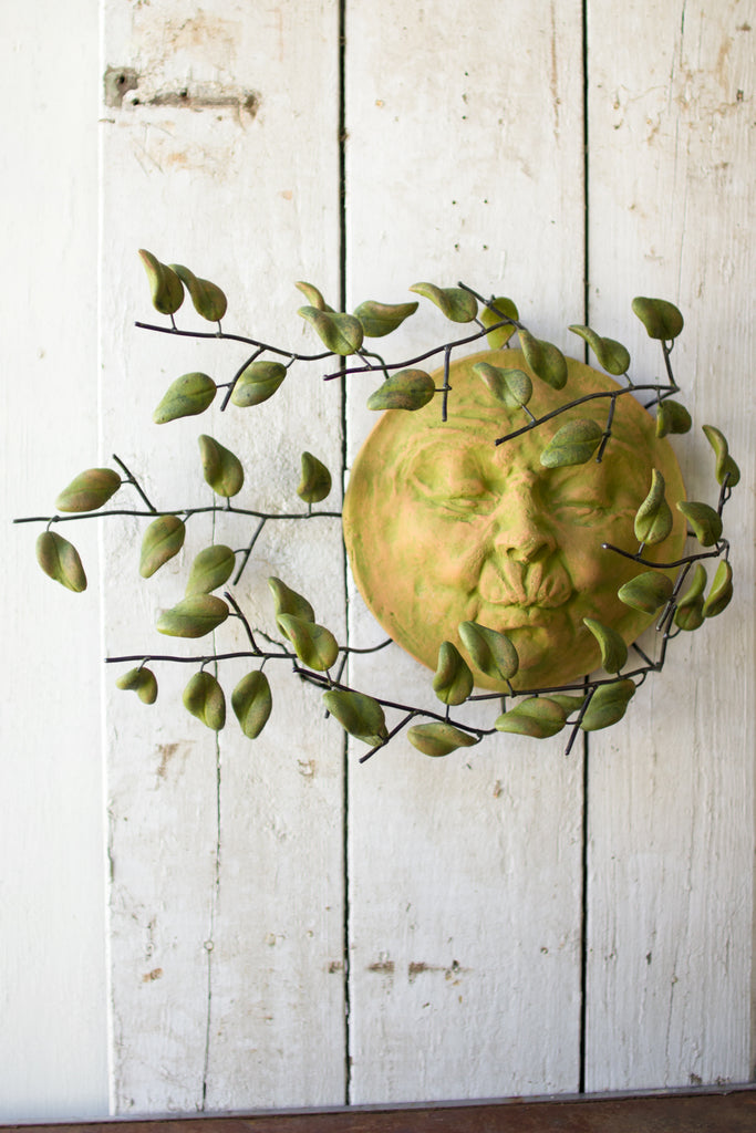 Wind Blown Sun Face With Clay Leaves