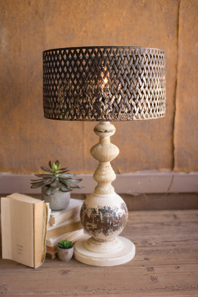 table lamp with round metal base and perforated metal shade