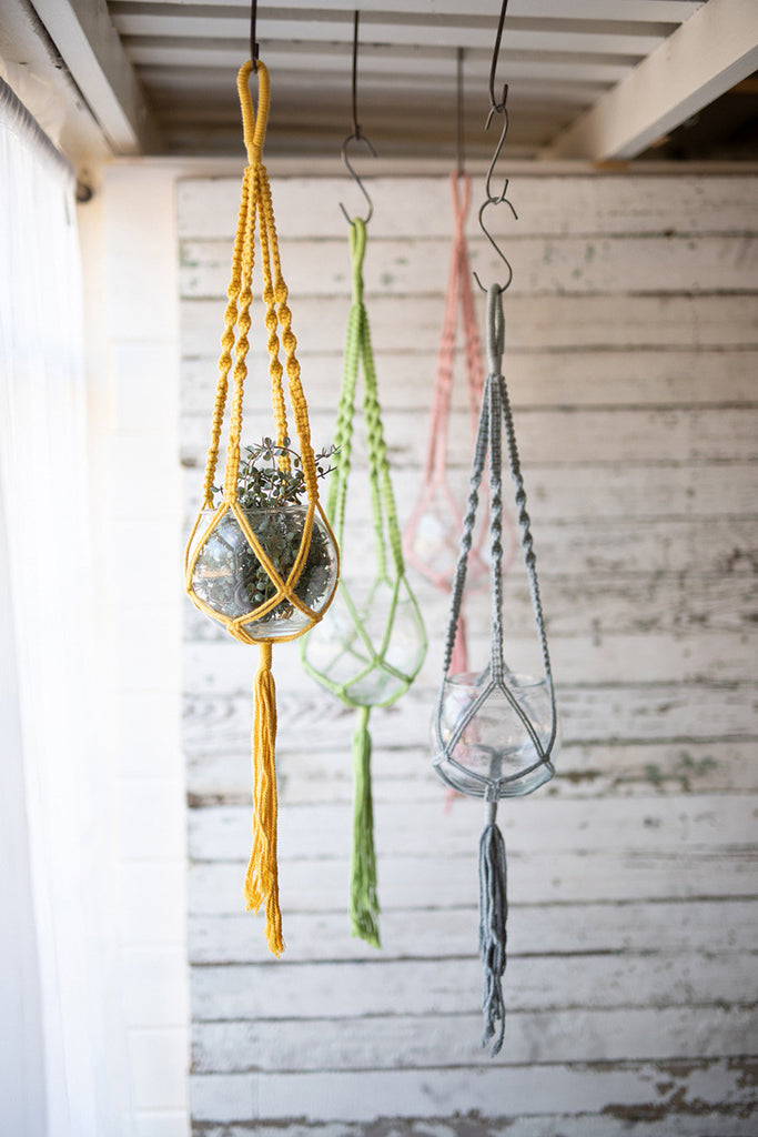 set of four hanging glass vases with cotton macrame