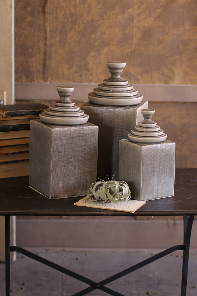 set of 3 grey textured ceramic canisters with pyramid tops