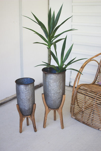set of 2 galvanized urns on wood bases