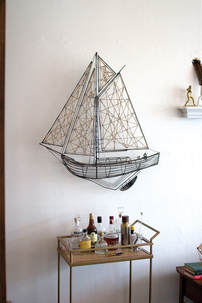 woven metal and jute sailboat wall hanging