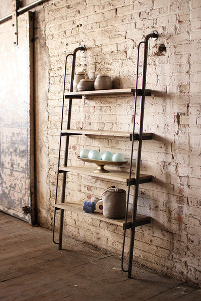 leaning wood and metal shelving unit
